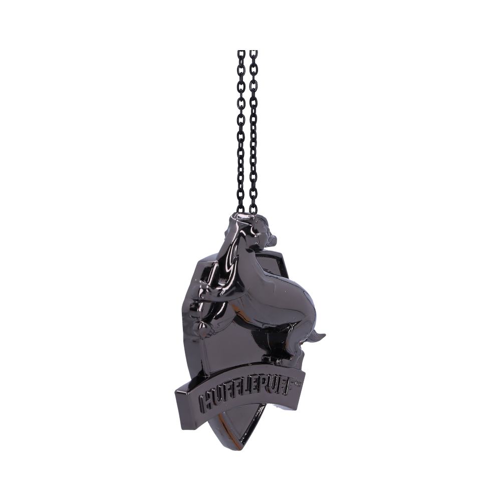 A metallic pendant shaped like a shield, featuring a raised badger and the word "HUFFLEPUFF," is suspended by a black chain. The background is plain white.