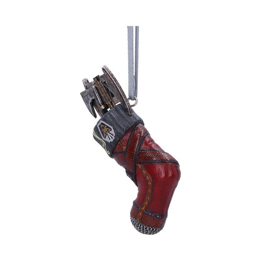 A detailed, red mechanical hand ornament features intricate metallic components and a hanging loop. It has a decorative patch with a star symbol and appears suspended in a neutral space.