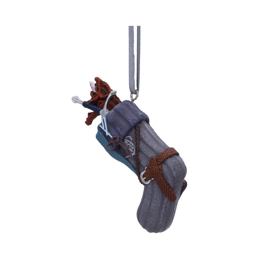 A climbing shoe ornament is suspended by a looped string. The shoe is detailed with laces, a toe patch, and various climbing gear. The background is plain white.