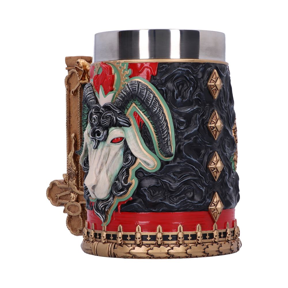 A decorative stein features a detailed goat head relief, with black and red patterns. Golden accents and diamond shapes adorn the sides, creating a gothic, medieval appearance.