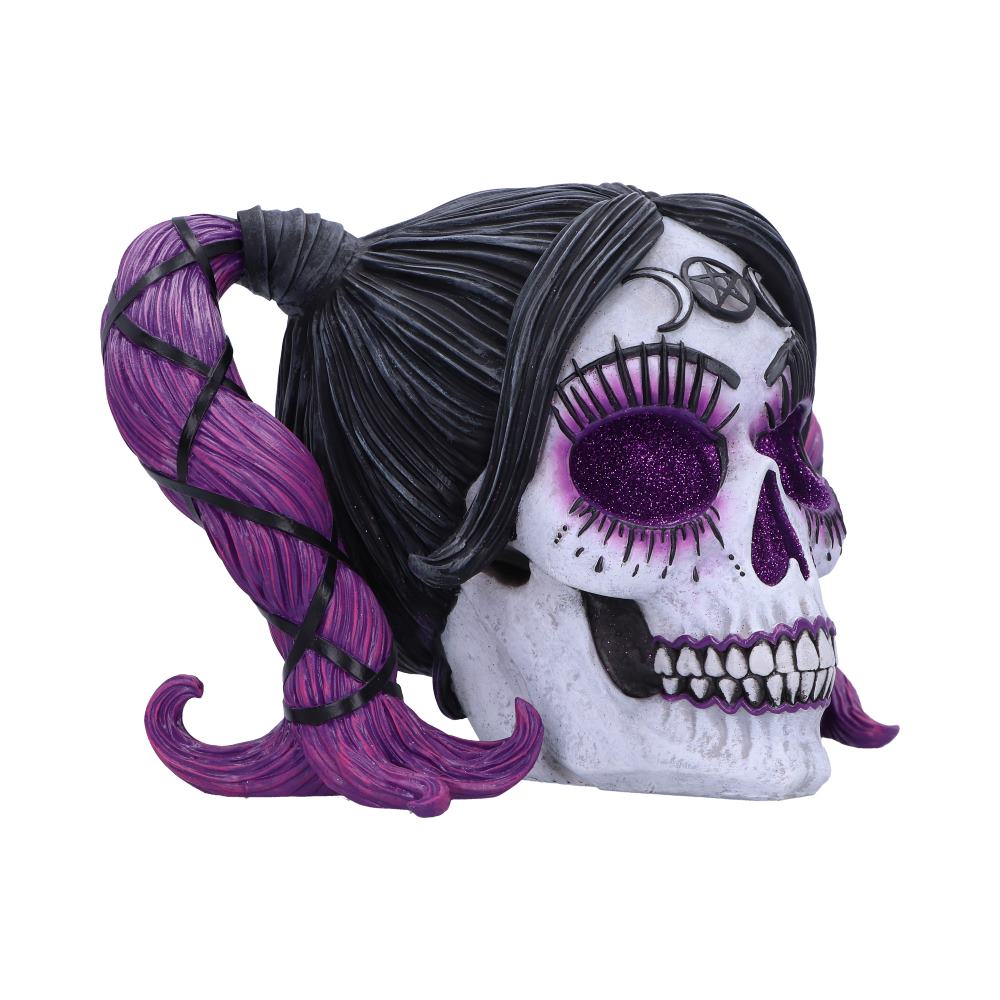 A decorative skull with purple glitter eyes and a pentagram on its forehead features intricate black and purple hair styled in a ponytail, set against a plain white background.