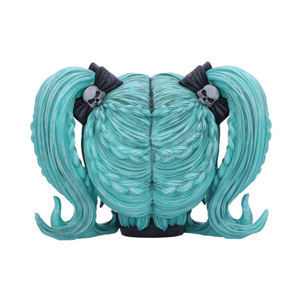 A sculpted figure of teal hair features braids forming twin tails secured with skull-adorned black bows. The hair's wavy design suggests movement. The background is plain white.