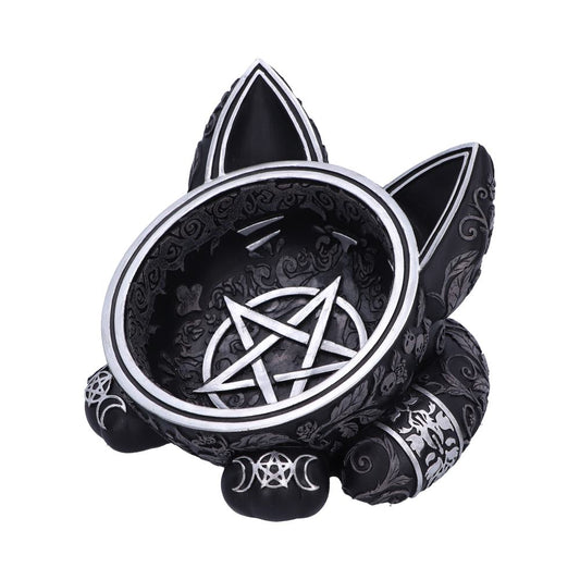 A black cat-shaped bowl with ears holds a silver pentagram design inside. The bowl is adorned with occult symbols and rests on a white background.