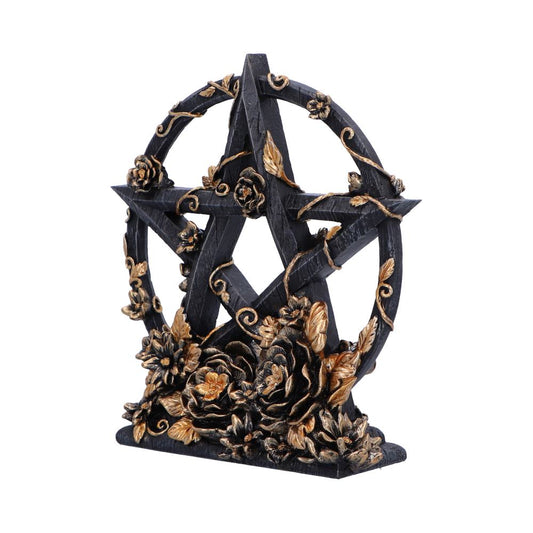 A pentagram statue stands; it is black with gold floral accents. The statue is ornate and rests on a small base.