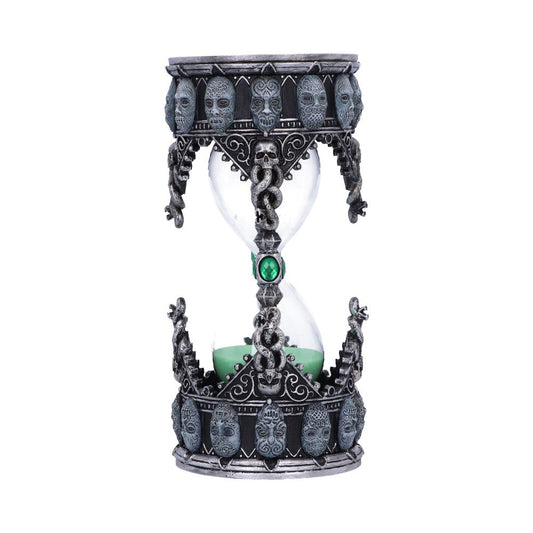 An ornate hourglass featuring detailed, skull-like designs on top and base, with green sand inside. It appears decorative, combining gothic motifs with a smooth glass centerpiece.
