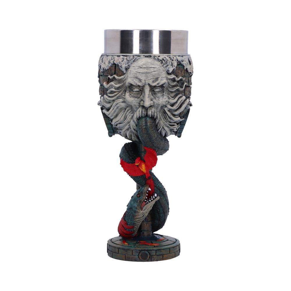 Goblet with a sculpted face and flowing hair, featuring a dragon twisting around the base, holding a colorful red element. The setting is neutral, focusing on the detailed design.