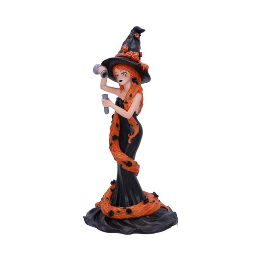 A witch figurine, holding a vial and what appears to be a hairdryer, is posed against a white background.