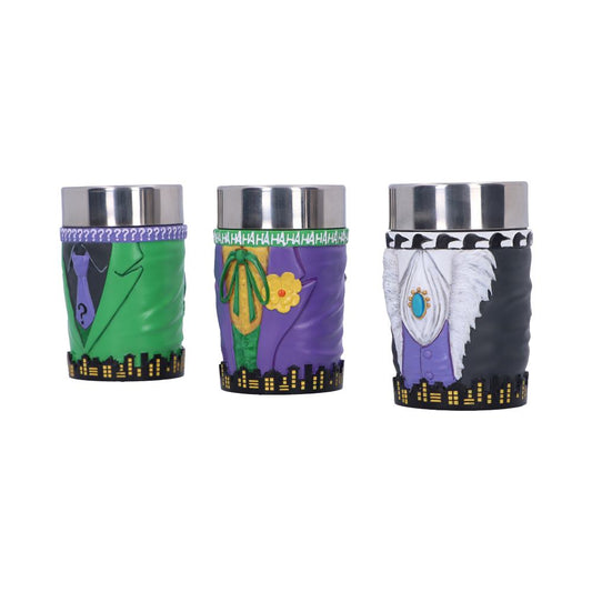 Three decorative metal cups, each designed with colorful superhero-themed outfits. The first features a green suit with a question mark, the second a purple suit with "HAHAHA" text, the third has a black and white fur design.