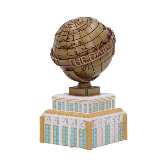 A bronze globe displaying continents is mounted on a stylized building model. Text on the globe reads "THE DAILY P". The building features light blue windows and decorative elements.