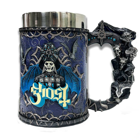 A decorative mug with an ornate handle, featuring a skeletal figure with a blue bat-like design. The backdrop is dark with patterns and bats. Text reads "Ghost" in stylized lettering.