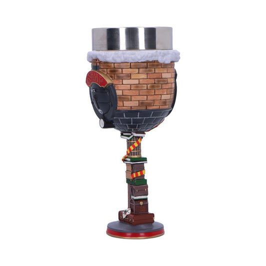 A decorative goblet features a chimney-shaped bowl and a base resembling stacked books. It includes details like a black train front labeled "Hogwarts Express" and a metal rimmed top.