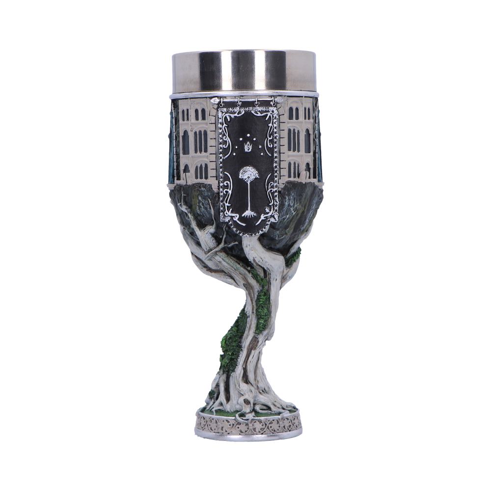 A decorative goblet features a tree-shaped stem with twisting branches. The cup is designed with an intricate cityscape and a black panel featuring a white tree, crown, and stars.