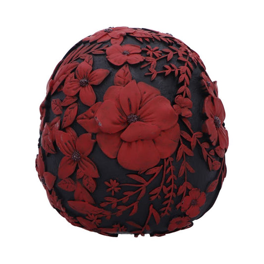 A black spherical object adorned with detailed red floral patterns, featuring large and small blossoms, creating an intricate, textured surface.