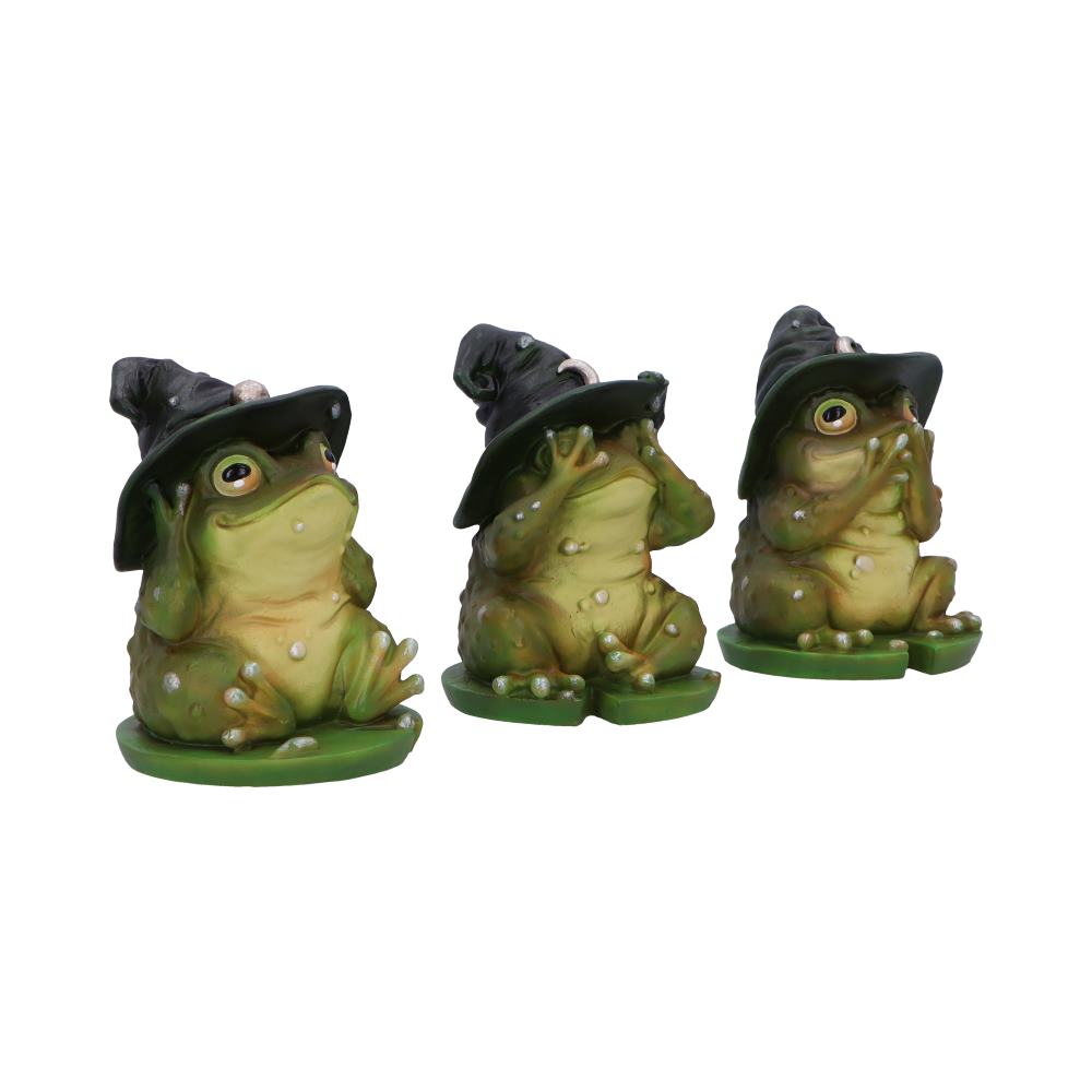 Three green frog figurines with witch hats, each covering their eyes, ears, and mouth respectively, symbolizing "see no evil, hear no evil, speak no evil" on plain green bases.