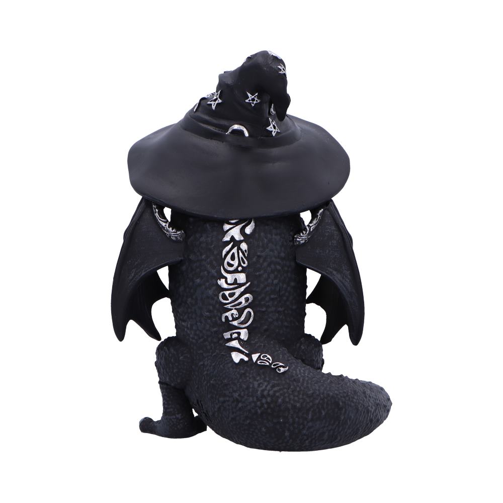 A black dragon figure sits adorned with a pointed wizard's hat decorated with stars. It has textured scales and white, rune-like symbols on its body and tail, against a plain backdrop.