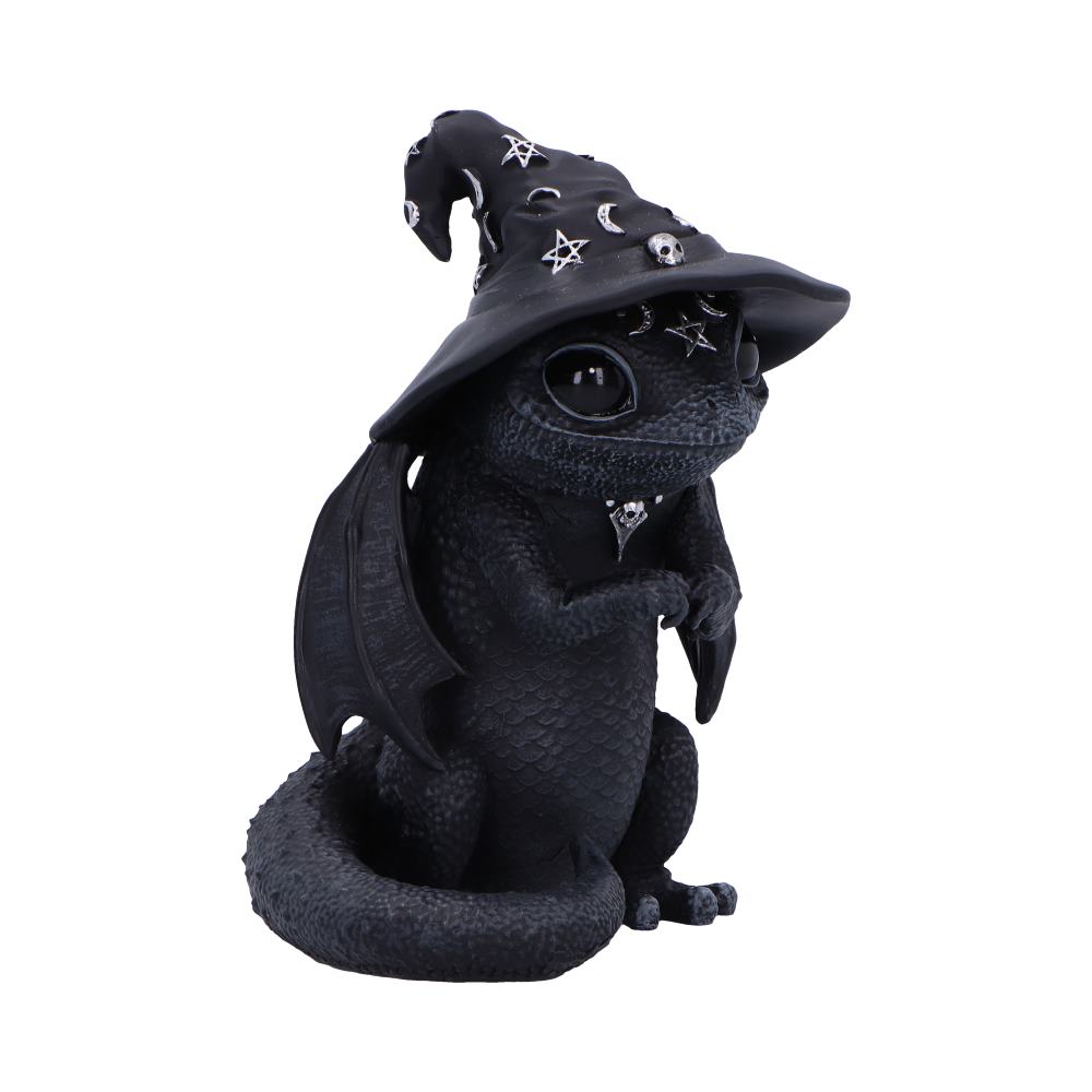 A black dragon figurine wears a witch's hat adorned with celestial symbols. It sits upright on its haunches, with wings folded and large, glossy eyes. The background is plain white.