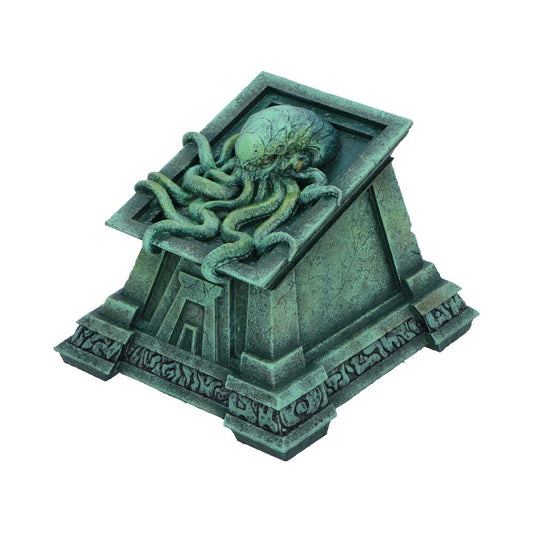 An intricate sculpture of an octopus-like creature extends its tentacles over a stone-like pyramid structure. The base features engravings resembling ancient symbols or glyphs.