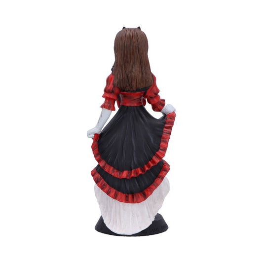 A ceramic figurine of a woman with long brown hair holding up a layered black and red skirt while standing on a small round base against a white background.