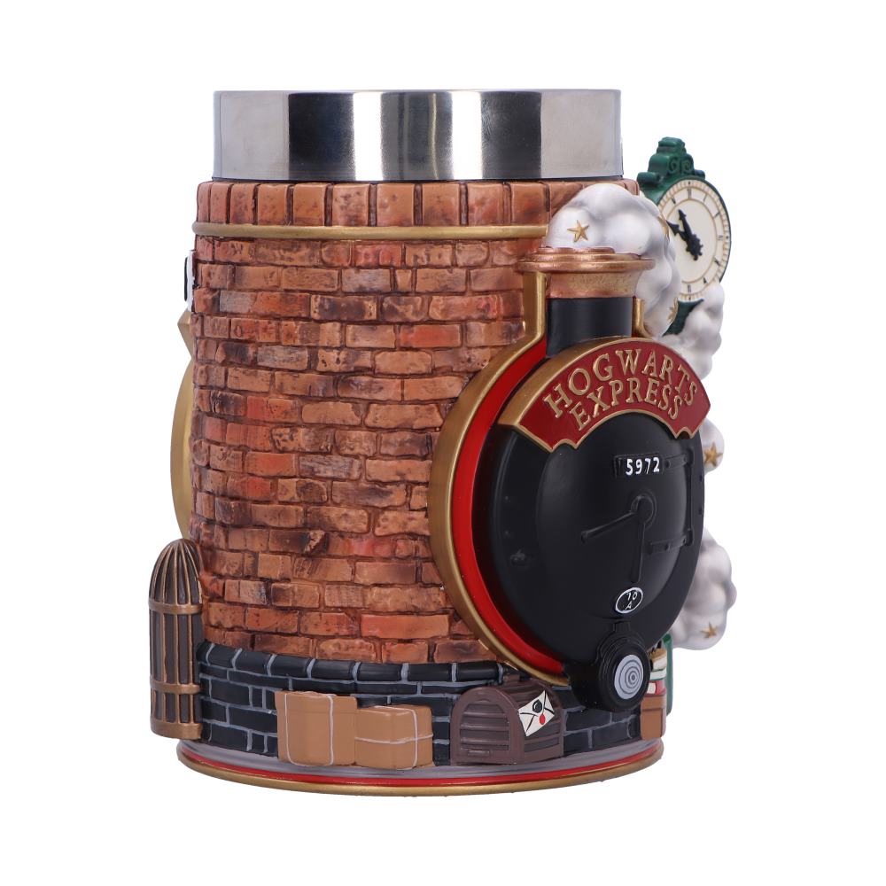 Ceramic Hogwarts Express mug shaped like a brick chimney, featuring a steaming train front labeled HOGWARTS EXPRESS 5972, perched amid luggage and a clock against a white background.