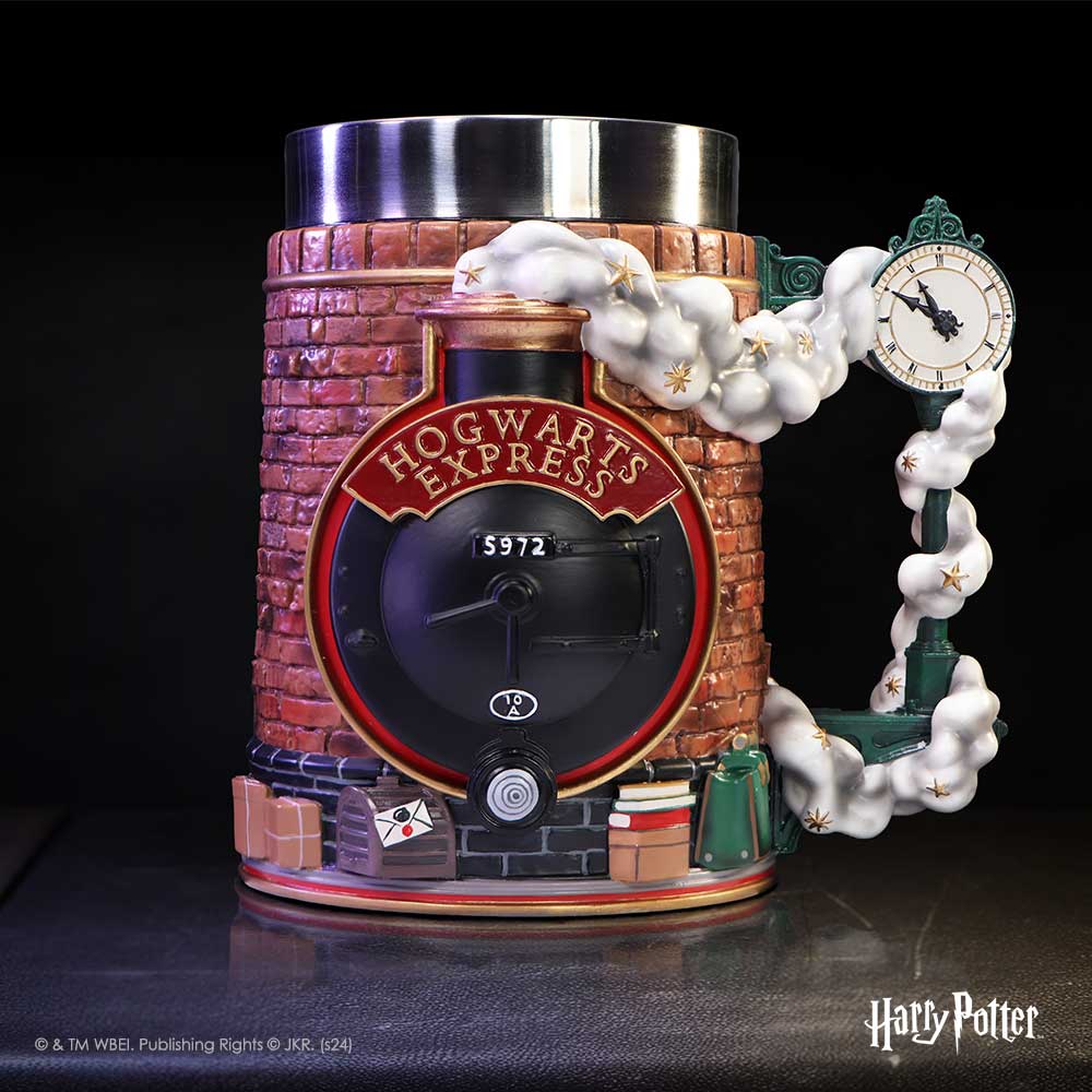 Hogwarts Express ceramic stein shaped like a brick train front emits starry steam that wraps a clock-shaped handle on a dark surface; Text: HOGWARTS EXPRESS; 5972; 10A; © & TM WBEI. Publishing Rights © JKR. (s24); Harry Potter