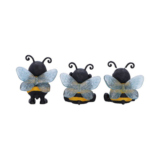 Three toy bumblebees sit facing away, showing translucent blue wings, black bodies with yellow stripes and curled antennae against a plain white background.