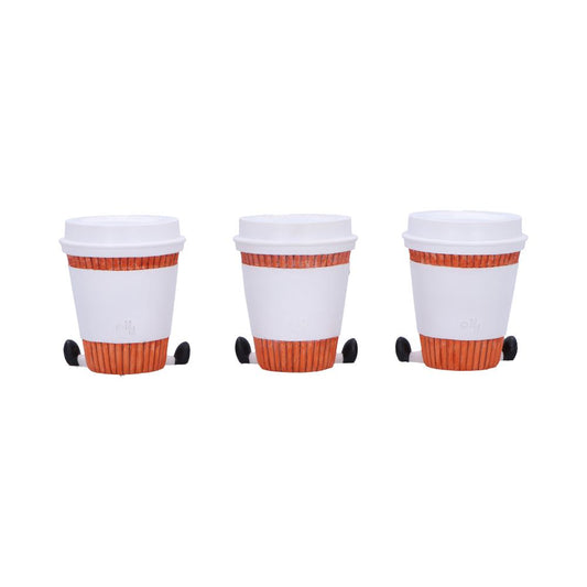 Three white takeaway coffee cups with orange ribbed sleeves and black stirrers resting beside each, aligned in a row on a plain white background.