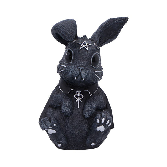 Black rabbit figurine sits upright, wearing a small cape and pentagram headpiece with a skull pendant, showing tiny fangs and painted paw pads against a plain white background.