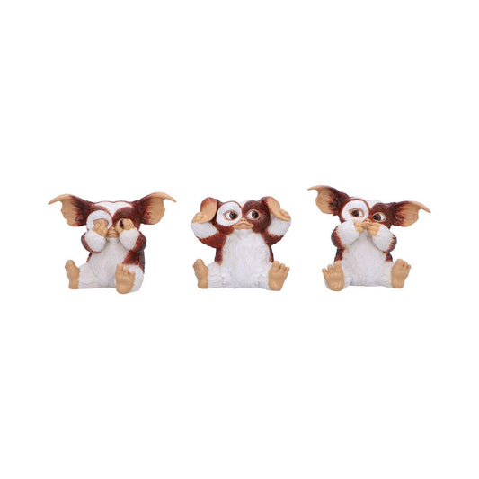 Three small brown-and-white creature figurines sit in a row: left covering eyes, center covering ears, right covering mouth, against a plain white background.