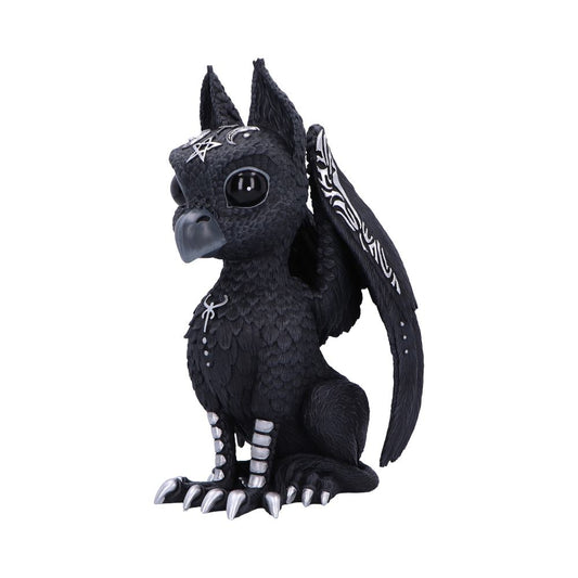Black griffin figurine sits facing slightly left, displaying folded patterned wings, silver beak and talons, decorative silver symbols on head and chest, against a plain white background.