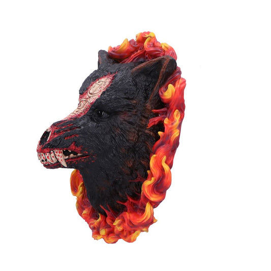 Black wolf head sculpture bares bloodied fangs with carved red facial markings, encircled by swirling red-orange flames against a white background.