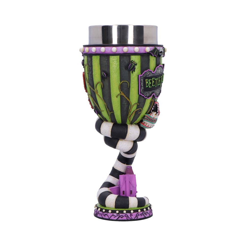 Decorative goblet perched on a twisted black and white striped stem against a white background, green and black striped cup with purple trim and tiny purple house at base; plaque reads BEETLEJUICE