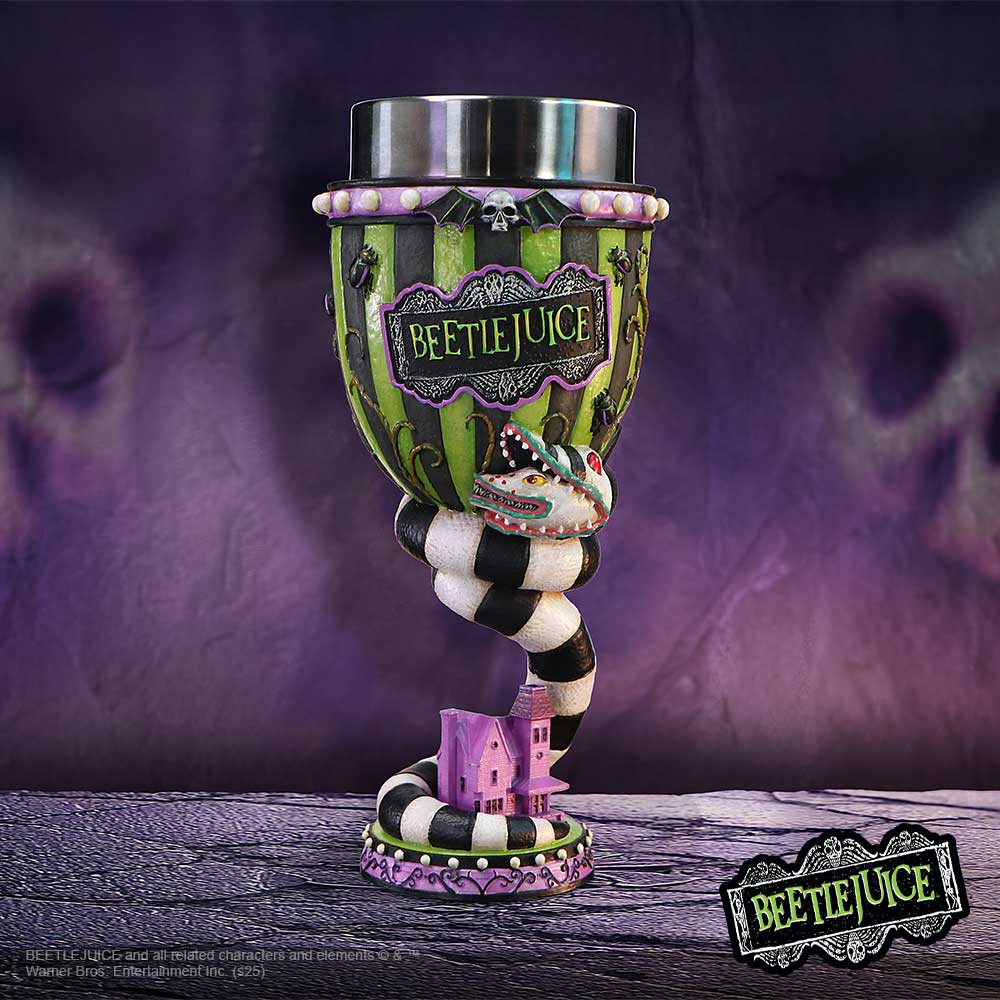 Decorative BEETLEJUICE goblet with a twisted black-and-white striped stem coiling around a small pink model house, standing on a textured surface against a purple backdrop; text: "BEETLEJUICE" and "BEETLEJUICE and all related characters and elements © & ® Warner Bros. Entertainment Inc. (s25)".