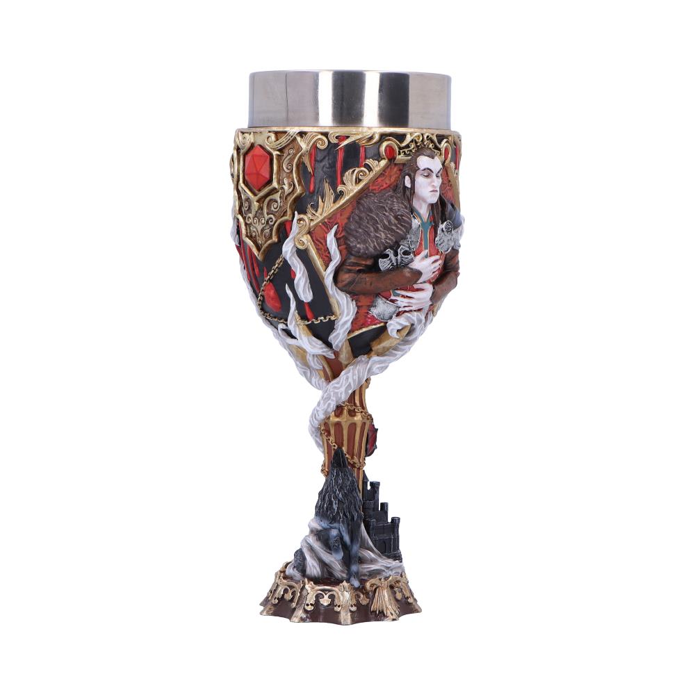 Ornate gothic goblet depicts a pale noble clutching an animal amid gold filigree and red gems, wrapped by white ribbons above a rocky base with a howling wolf and castle ruins.