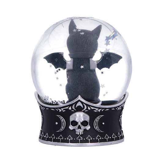 Black cat figurine sits with bat wings spread amid floating stars inside a snow globe atop a black gothic base decorated with a skull and crescent moons on white background.