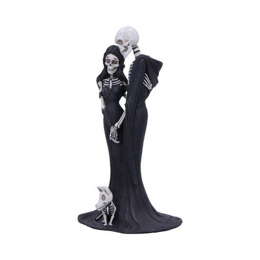 Skeletal couple embracing: male in hooded cloak kisses female's skull while both wear long black gowns, a small skeletal dog sits at their feet on plain white background.
