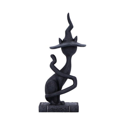 Black stylized cat statue wearing a tall crooked witch hat sits on a rectangular base with its long tail curling around its body against a plain white background.