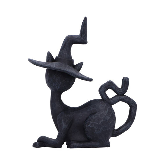 Dark textured cat figurine sits wearing a wide crooked witch hat, its curled tail forming a geometric loop, posed on a clean white background.