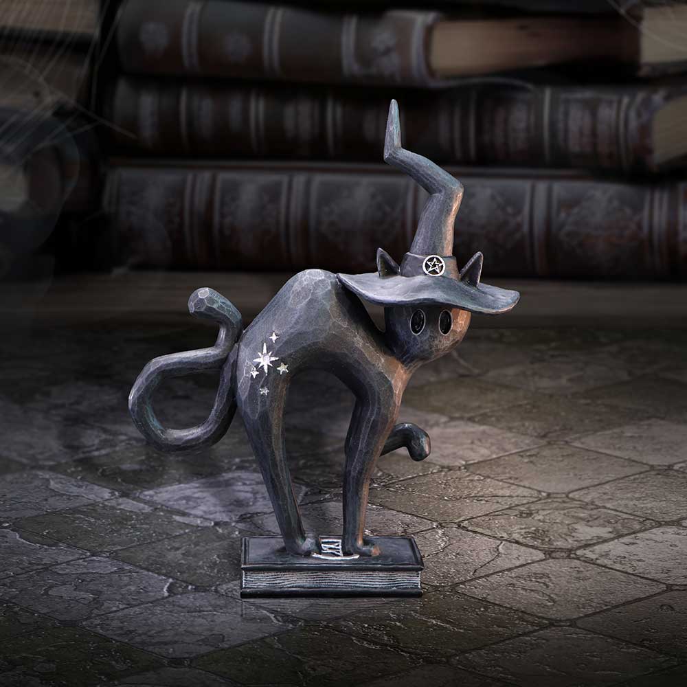 Hex Spell Cat Figurine – black resin cat perched on a spellbook with witchy accents