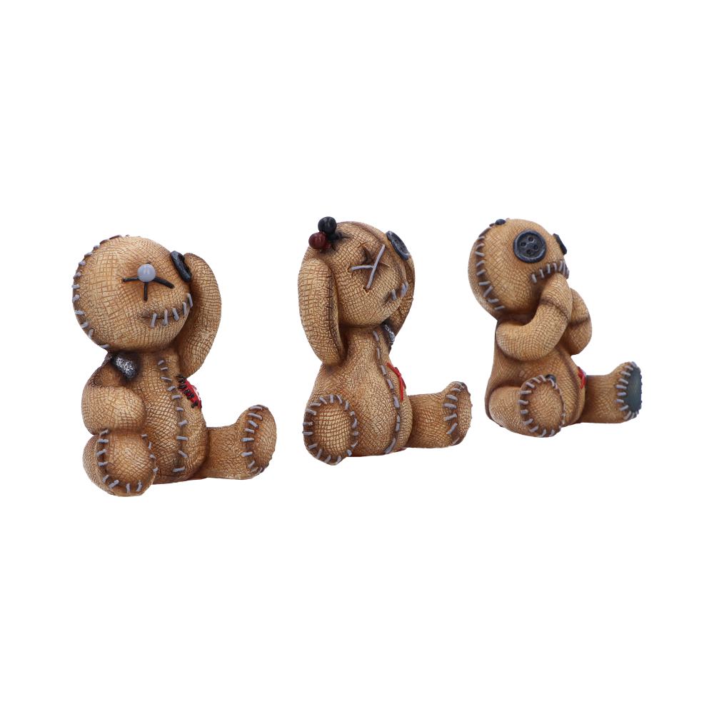 Three stitched burlap teddy figures sit in a row with button eyes and visible seams, one covering eyes, one covering ears, and one covering mouth on a white background.