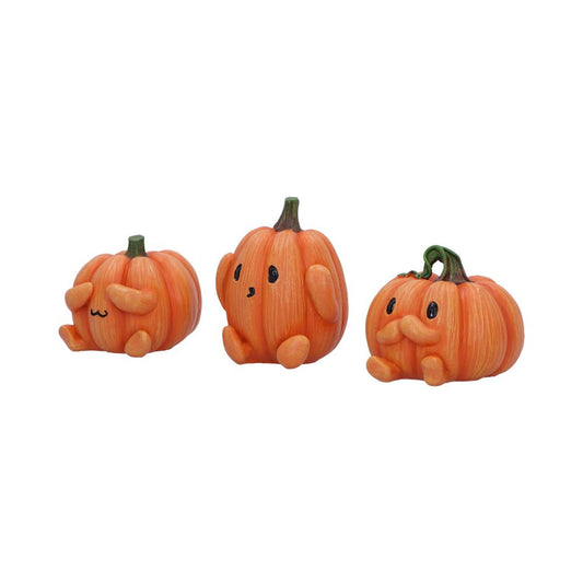 Three orange pumpkin figurines sit on a white background; one covers its eyes, one faces forward with tiny arms, and one smiles with a stubby mustache.