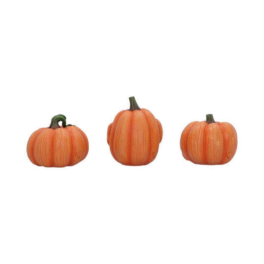 Three small orange pumpkins sit in a row, each with a green stem and ridged surfaces, photographed against a plain white background