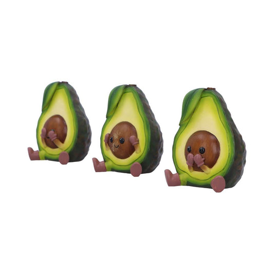 Three avocado halves with smiling seed characters covering their eyes, ears, and mouth respectively while sitting side-by-side on a plain white background.