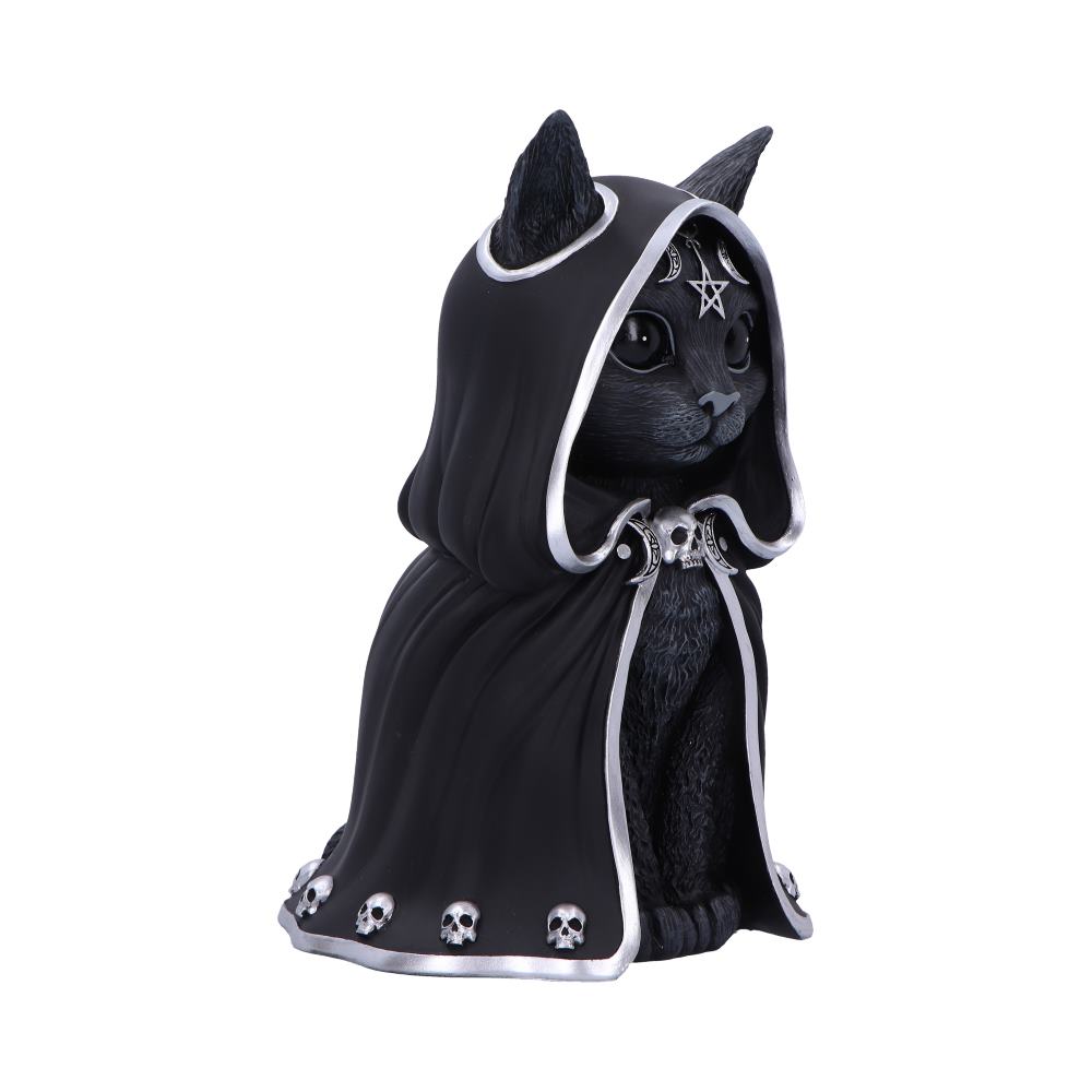 Black cat figurine sits wearing a hooded black cloak trimmed in silver, decorated with small skulls and a pentagram on its forehead, posed against a plain white background.