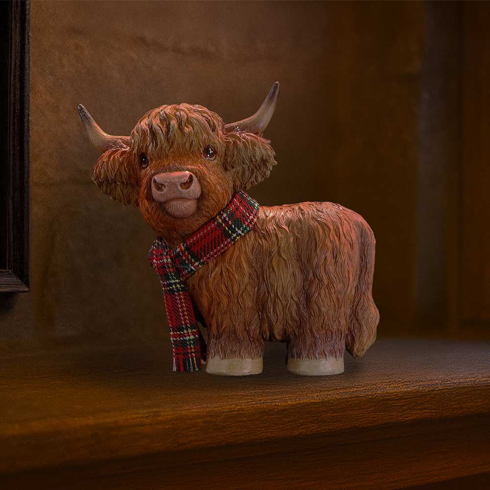 Highland Cow Snug Figurine – hand-painted resin Highland cow wearing a cosy warm scarf