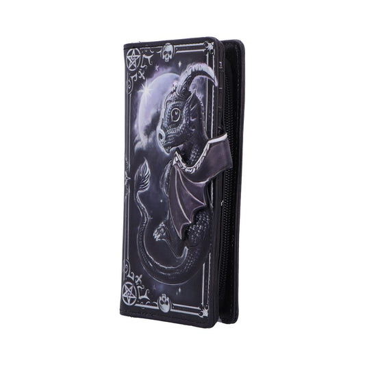 A tall black zippered wallet displays a curled embossed dragon with wings and crescent moon above, set within ornate borders and pentagrams, photographed standing upright against a white background.