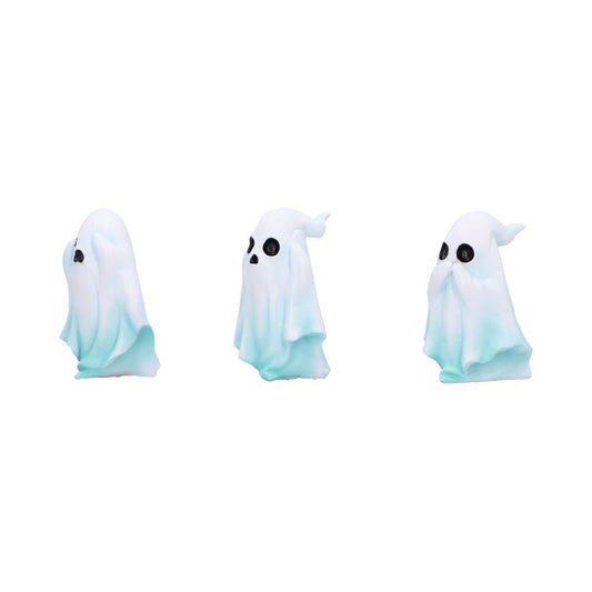 Three small pale blue-and-white ghost figurines stand in a row facing slightly different directions against a plain white background.