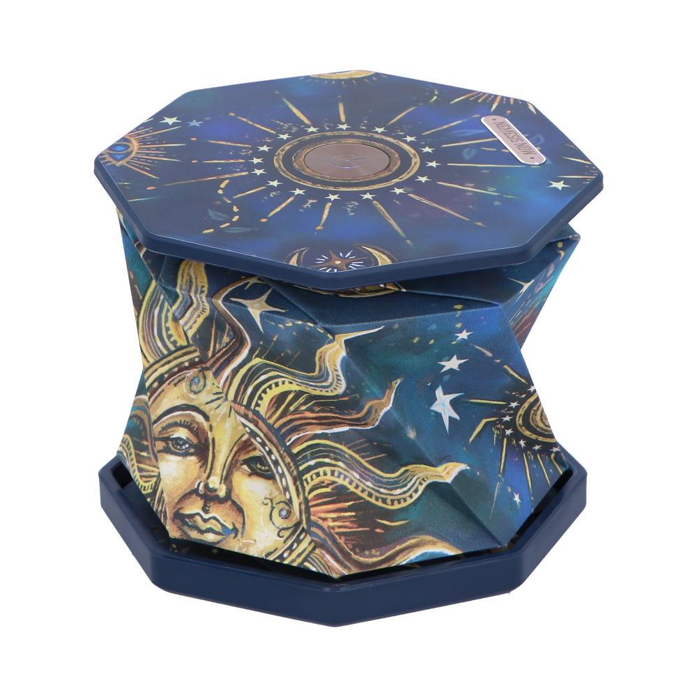 Octagonal collapsible stool displays a gold sun face and starburst artwork on deep blue fabric, sitting upright on a plain white background.