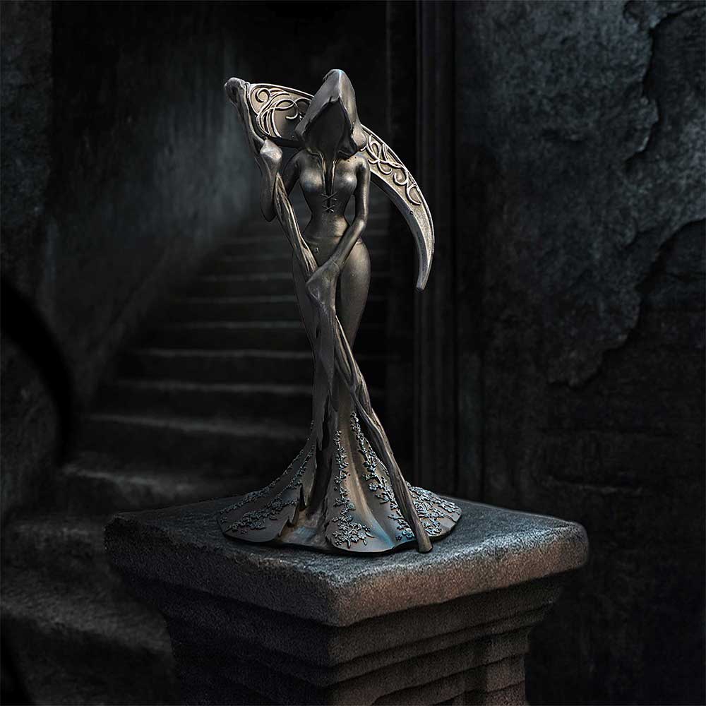 Femme Fatale Reaper Gothic Figurine - displayed against dark stone with the scythe arching around the figure