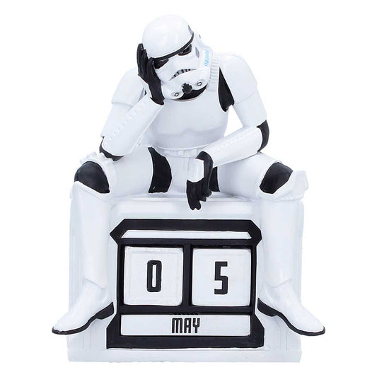 Seated Stormtrooper resting his head above black-and-white calendar date blocks