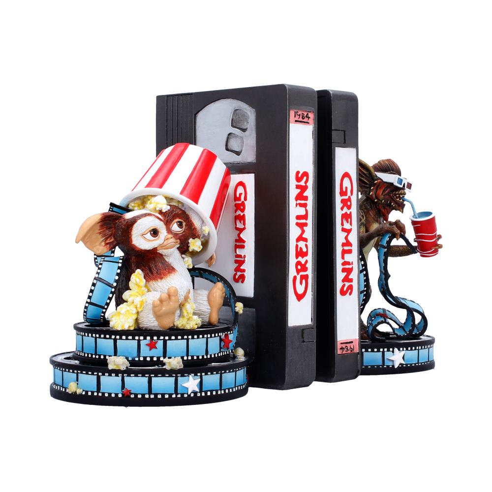 Opposite angle of the pair with Gizmo beside a striped popcorn container